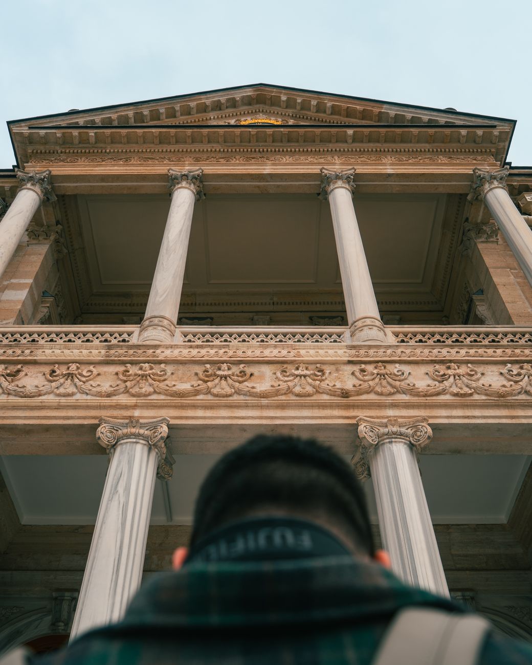 A traveler admiring ancient architectural courtyard