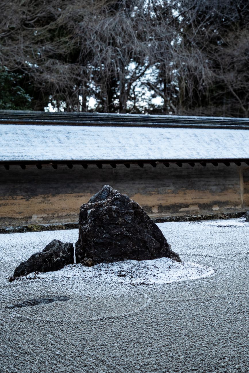 A quiet zen rock and moss garden in northern Kyoto at sunrise
