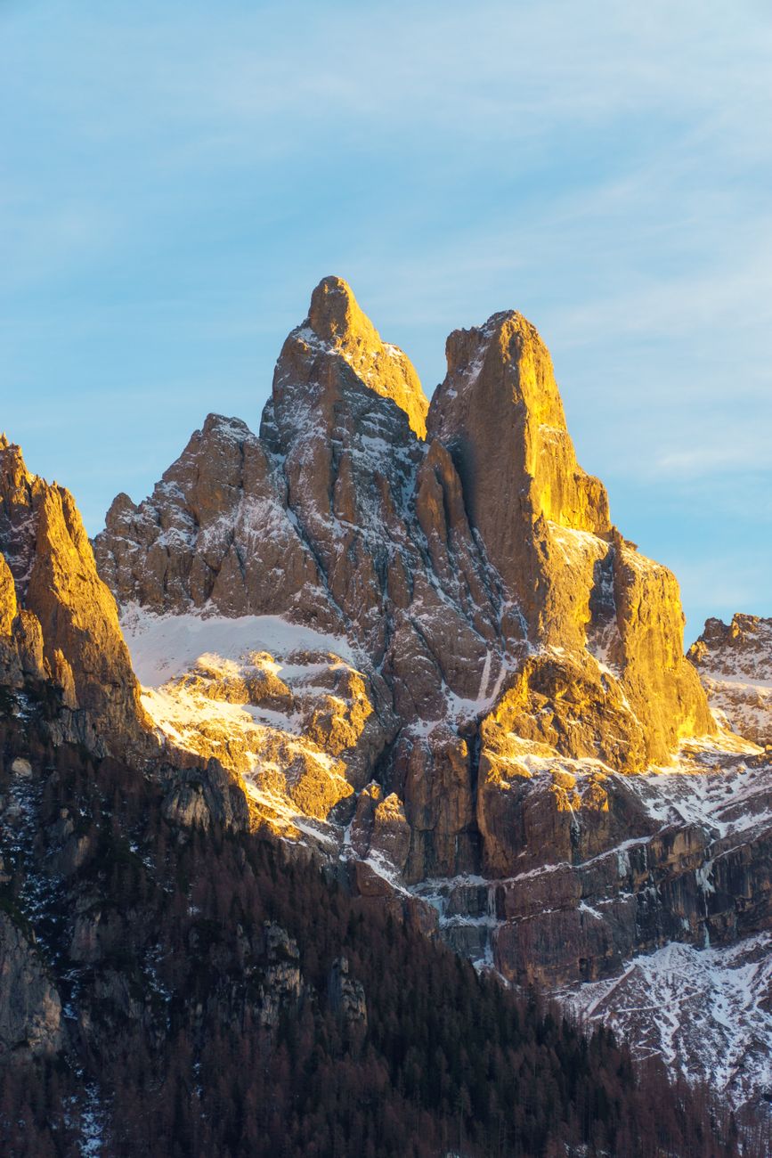 The dramatic jagged peaks of the Dolomites under late afternoon golden alpenglow