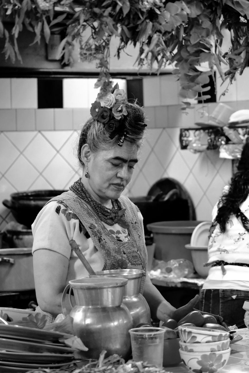 Traditional clay cooking vessel with chilies and culinary ingredients in Oaxaca