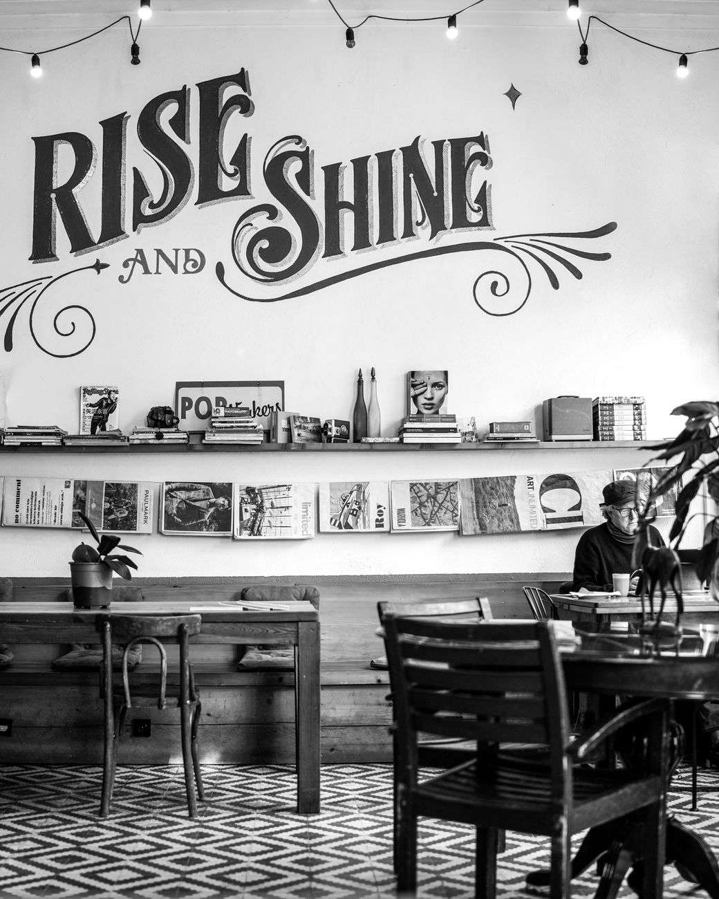 Atmospheric coffee house and traveler reading a book